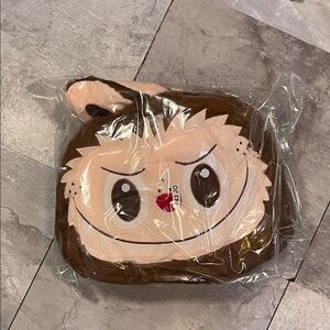 Labubu character plush backpack in brown.